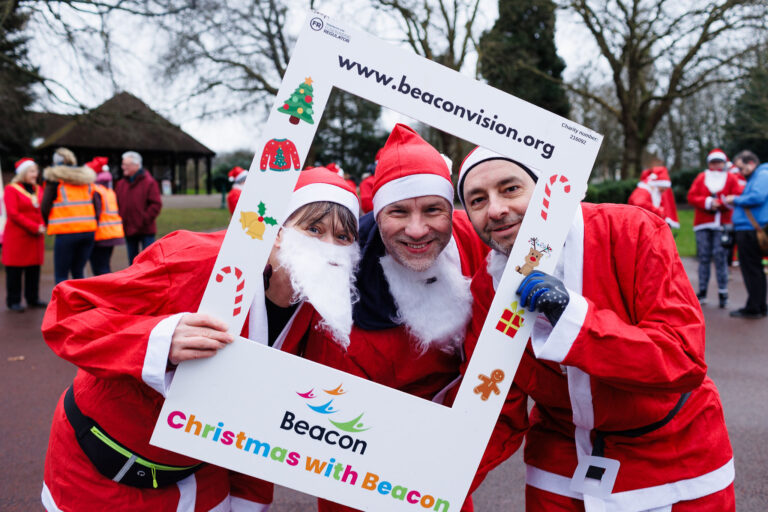 This shows three participants holding a selfie board.